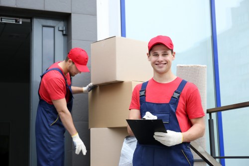 Office moving team preparing business equipment in Roehampton