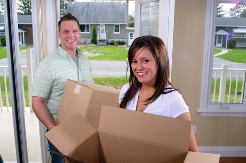 Movers handling furniture carefully during a house move in Roehampton