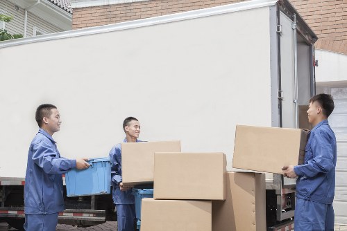 Removal van and packed boxes for Roehampton moving services
