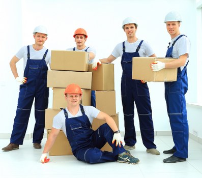 Packed office boxes and furniture ready for relocation in Roehampton